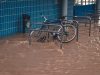 Storm Kristin Kills 5, Exposes Portugal Climate Risk Debris-strewn streets and damaged buildings in a Portuguese coastal town after Storm Kristin, with storm clouds lingering overhead.