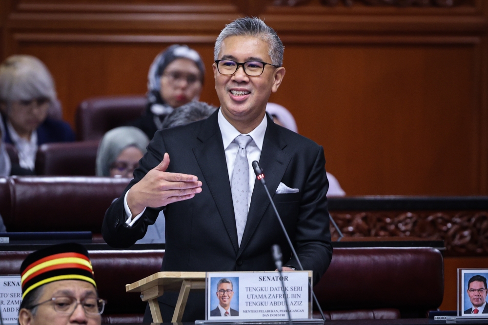 Malaysian Finance Minister Tengku Zafrul speaking at a virtual event about unorthodox economic reforms and digital inclusion strategies.